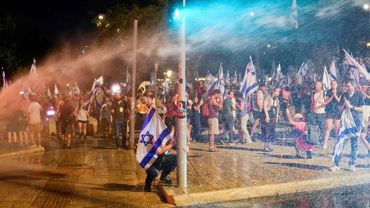 Israeli protester with flag