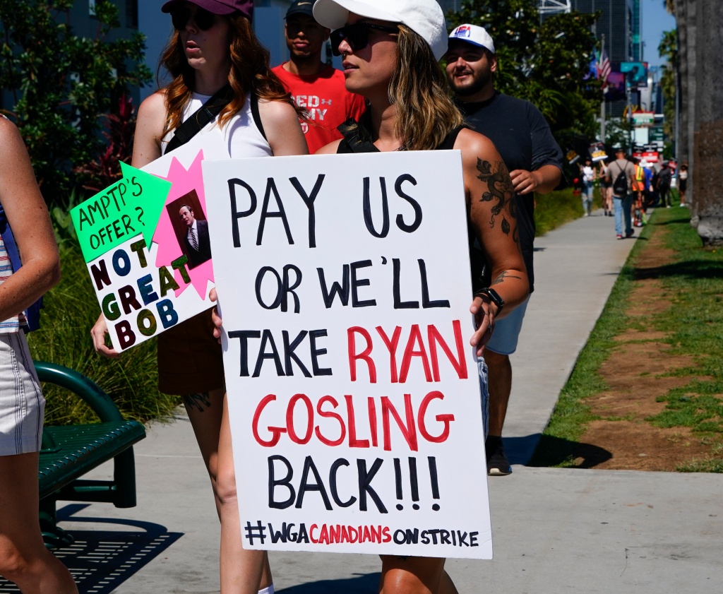 Members of actors union, SAGA-AFTRA and the writers union, the WGA, picket at Bronson Studios home of Netflix on July 12, 2023.