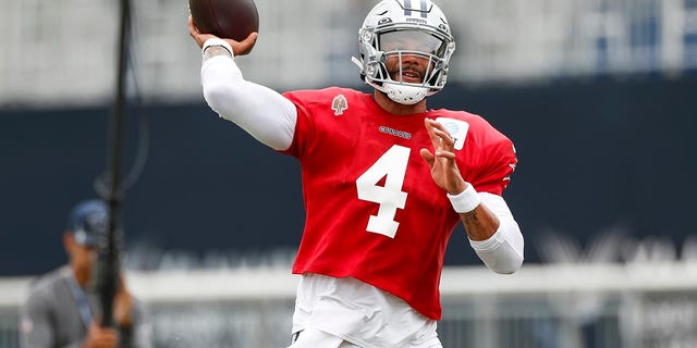 Dak Prescott throws at training camp