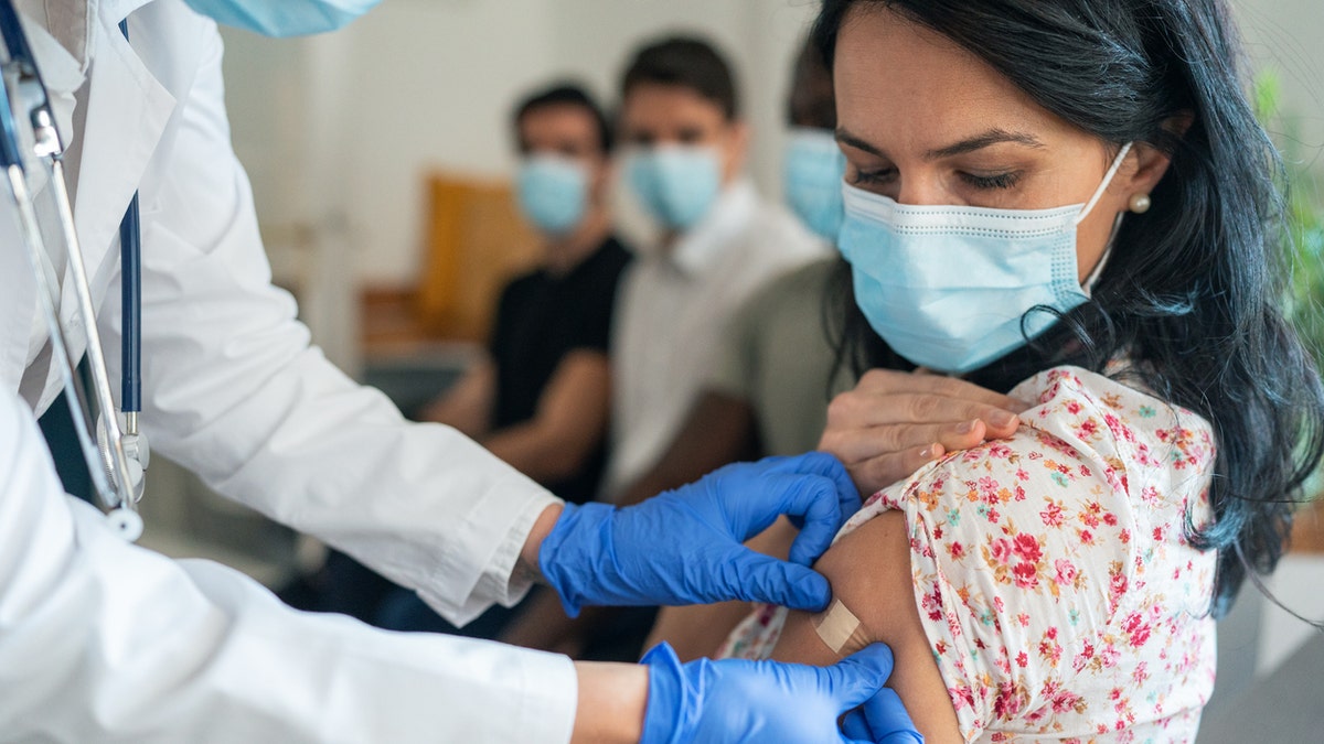 Woman getting vaccine