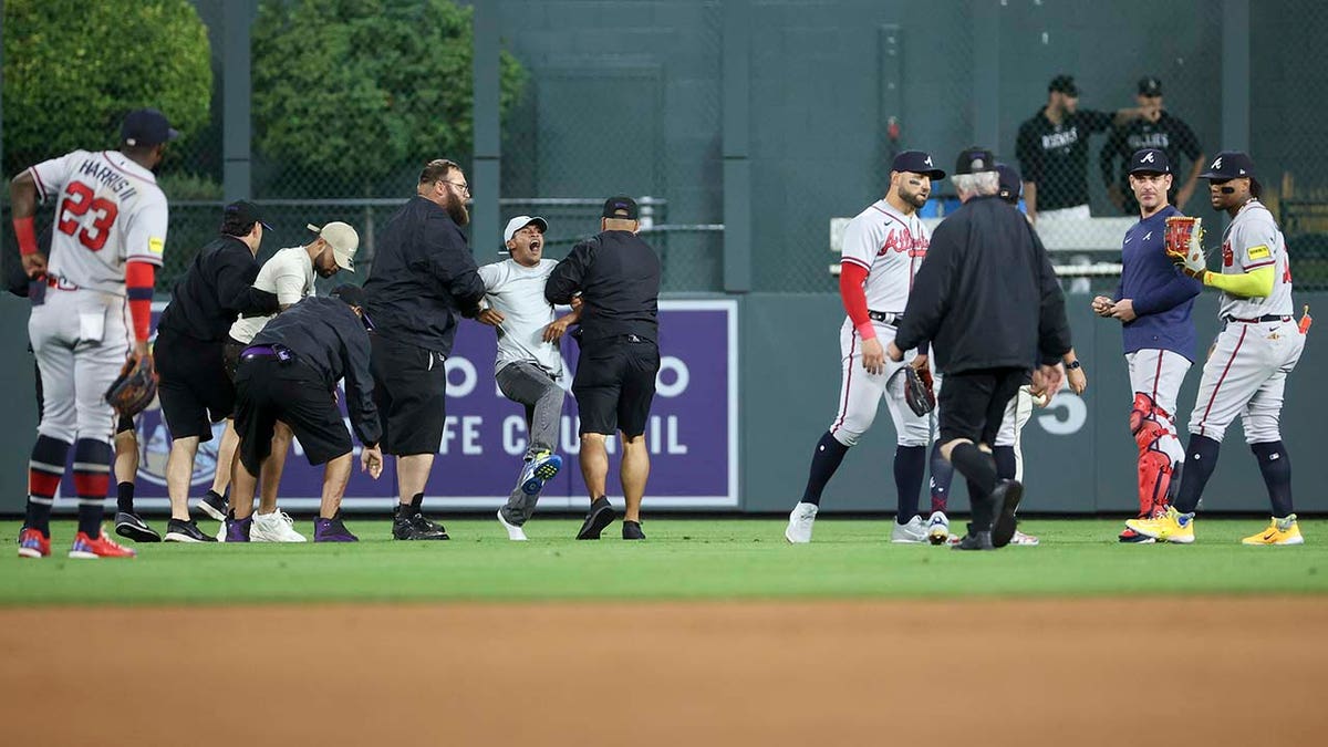 A fan yells to Ronald Acuna Jr.