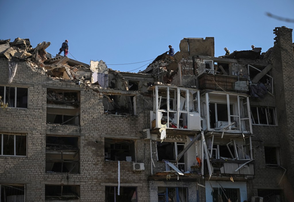 Rescuers work at a site of a building destroyed during a Russian missile strike, amid Russia's attack on Ukraine, in Pokrovsk, Donetsk region, Ukraine August 8, 2023. 