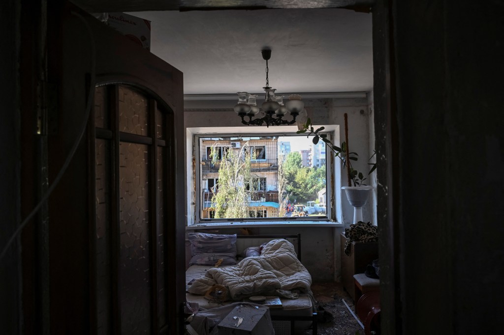 A local resident sleeps in his flat in an apartment building damaged during a Russian missile strike, amid Russia's attack on Ukraine, in Pokrovsk, Donetsk region, Ukraine August 8, 2023. 