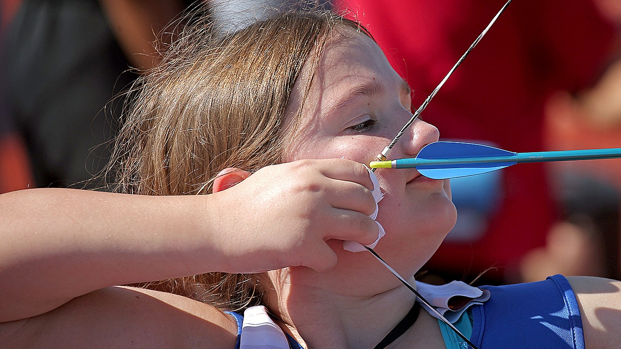 Vivan Hoop competes in archery