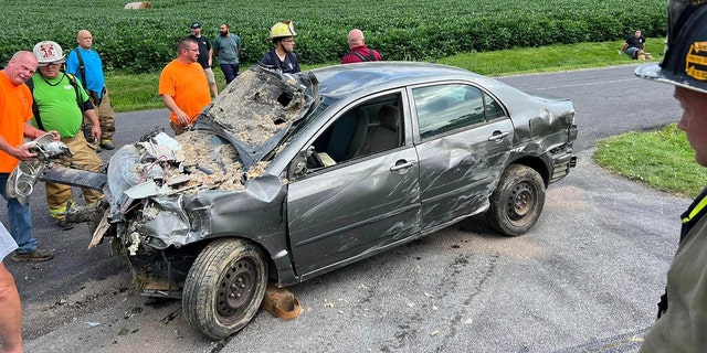 Damaged car after crashing into home