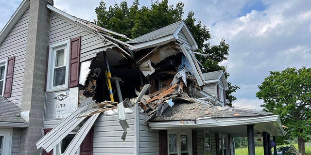 Hole in the house from car