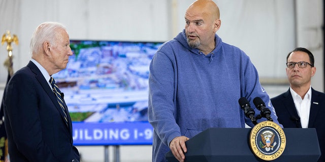 US President Joe Biden and Pennsylvania Governor Josh Shapiro look on as US Senator John Fetterman