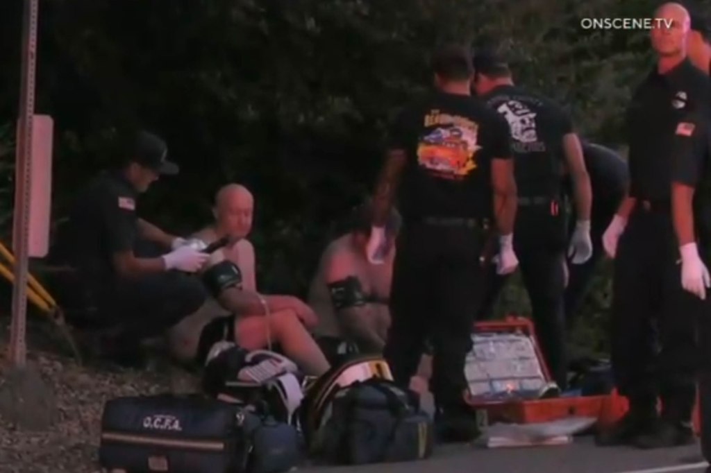 Emergency and medical response staff are seen treating victims after a bar shooting in Orange County, Calif., on Aug. 23.  