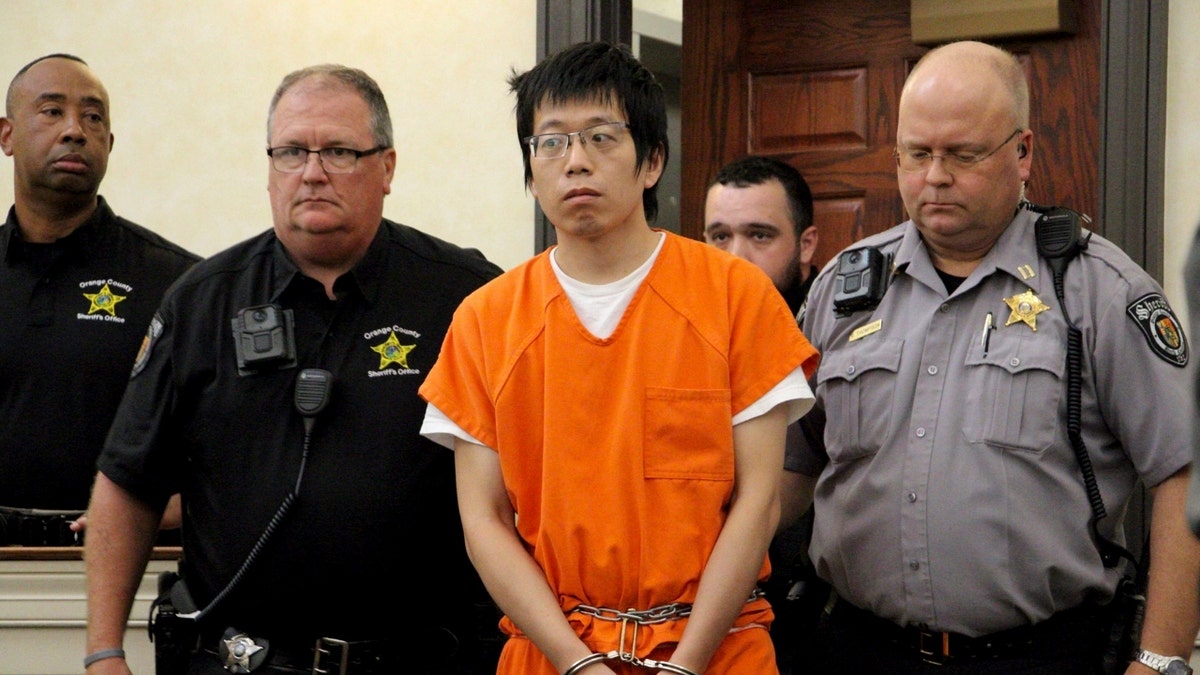 Tailei Qi, the graduate student suspected in the fatal shooting of a University of North Carolina at Chapel Hill faculty member, makes his first appearance at the Orange County Courthouse in Hillsborough, N.C., Tuesday, Aug. 29, 2023.