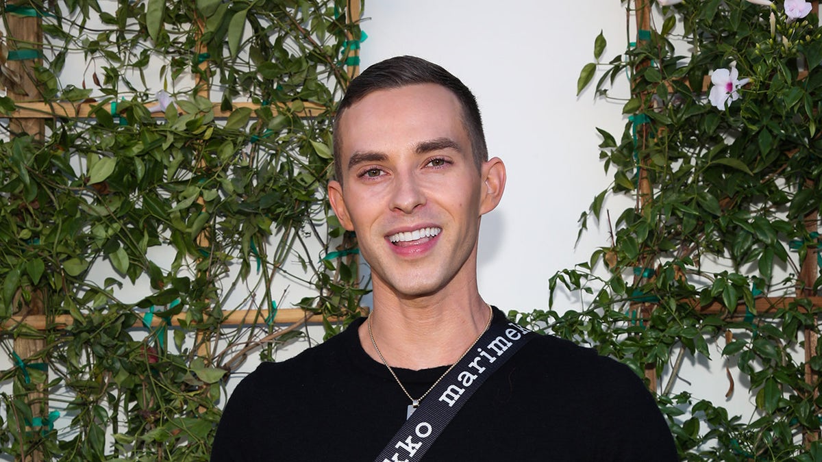 Adam Rippon smiles