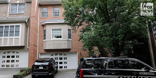 Police cars outside a suburban home