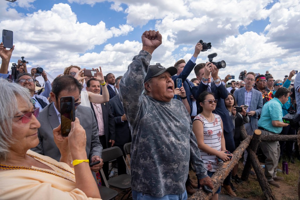 Supporters photograph as President Joe Biden signs a proclamation designating the Baaj Nwaavjo I'Tah Kukveni National Monument at the Red Butte Airfield Tuesday, Aug. 8, 2023, in Tusayan, Ariz.