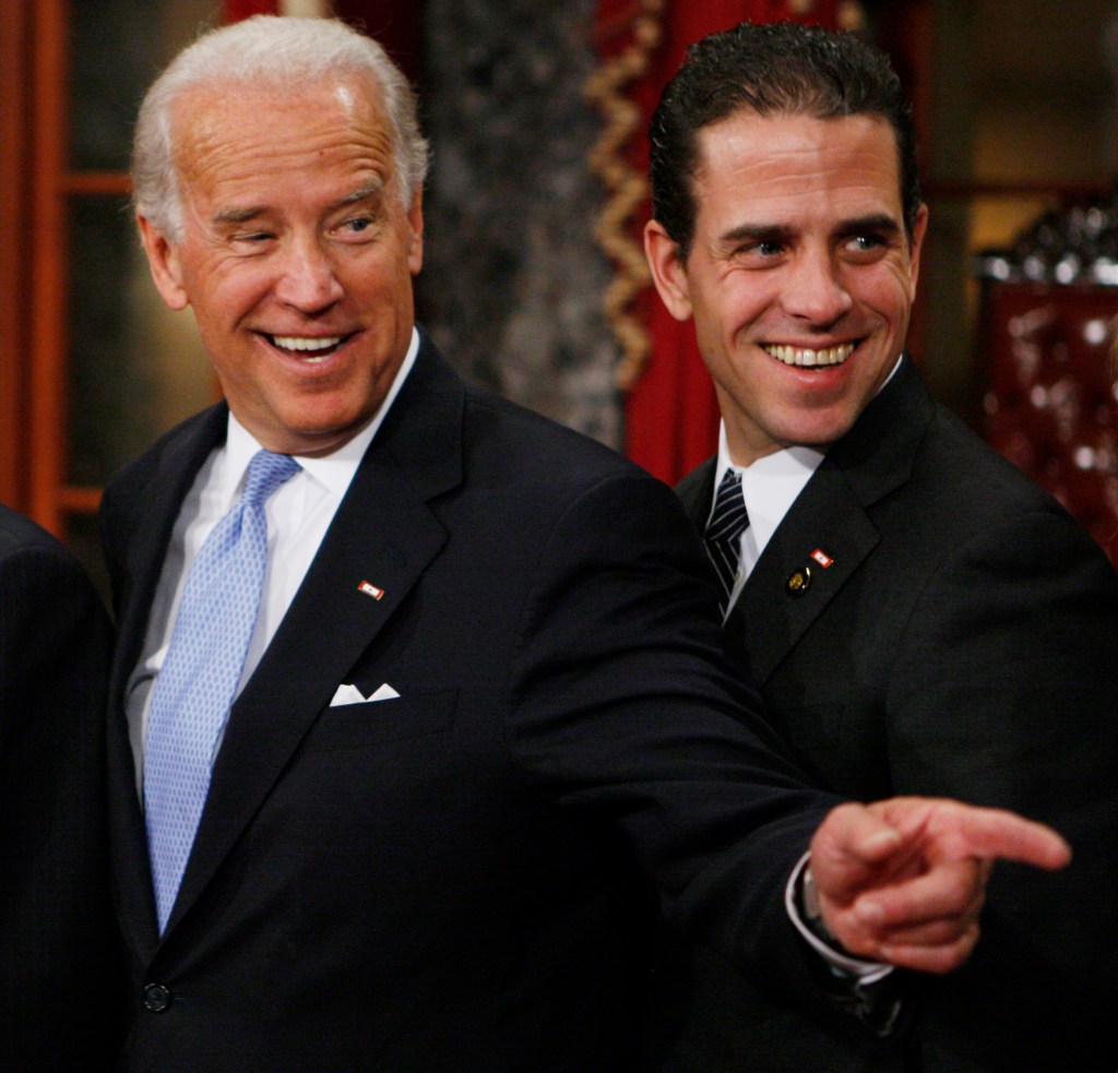 Then Vice President-elect, Sen. Joe Biden, D-Del., left, stands with his son Hunter during a re-enactment of the Senate oath ceremony in the Old Senate Chamber on Capitol Hill in Washington on Jan. 6, 2009. 