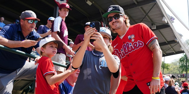 Bryson Stott interacts with Little Leaguers