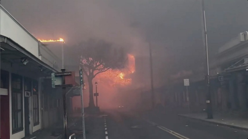 Smoke and flames fill the air from raging wildfires on Front Street in downtown Lahaina, Maui on Aug. 8, 2023. 