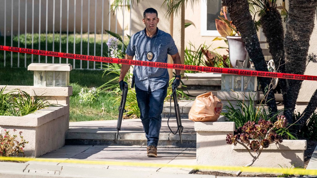 Investigators remove firearms from the judges house in Anaheim, Calif., on Aug. 4, 2023.