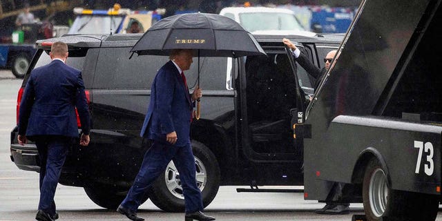 Donald Trump prepares to board his plane and depart Washington D.C.