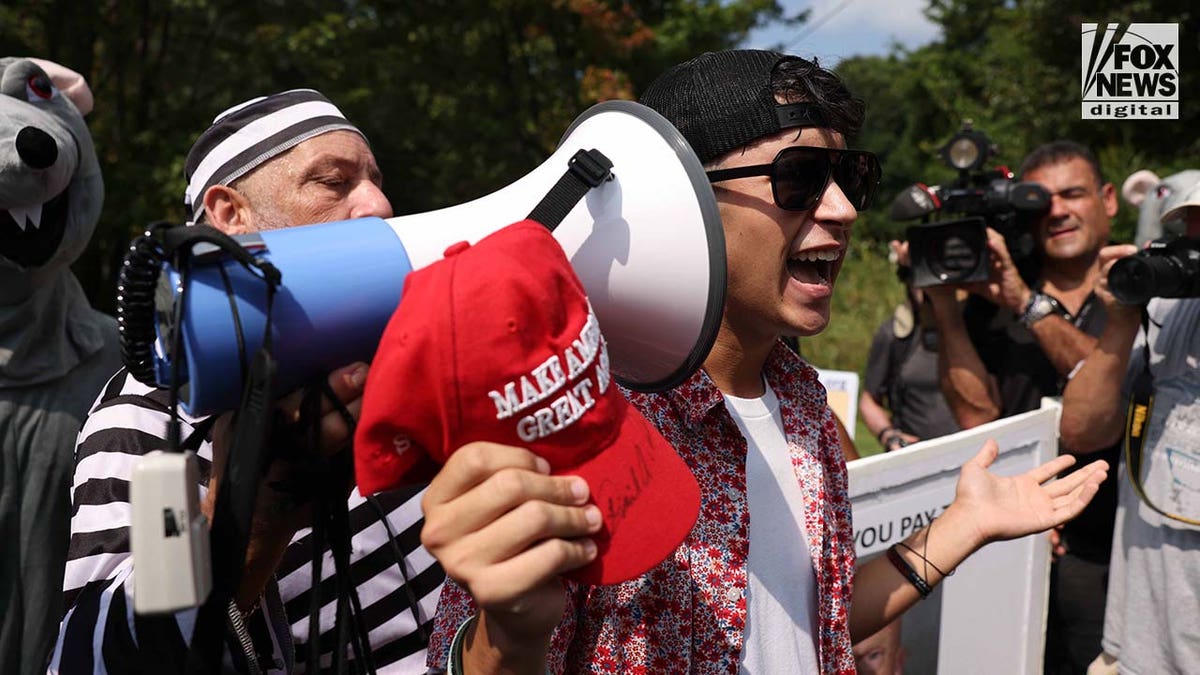 Supporters and counter protesters gather at the Fulton County Jail