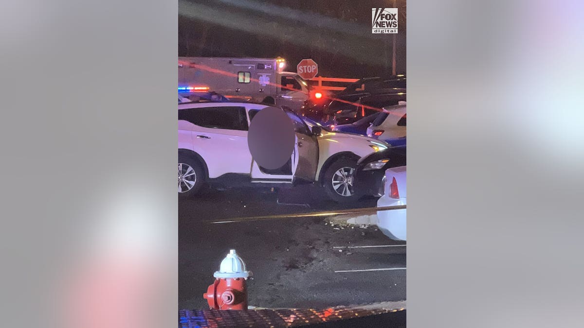 car stopped and damaged in front of other cars