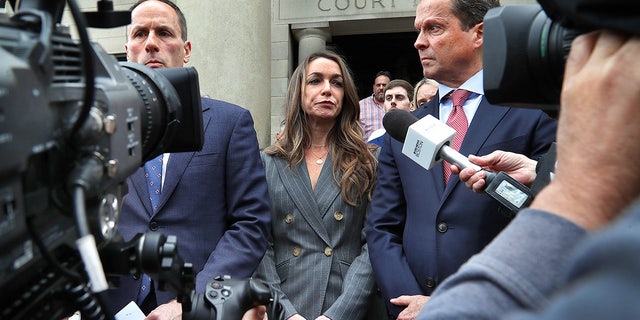 Karen Read outside court with reporters