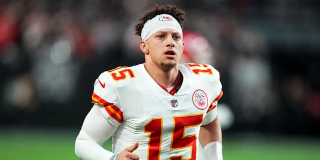 Patrick Mahomes runs onto the field against the Raiders