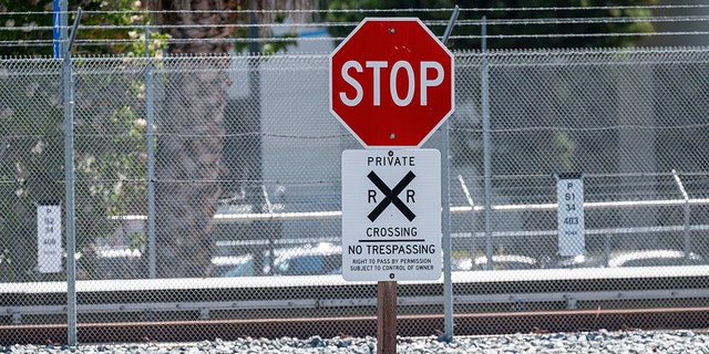 A stop sign near tracks