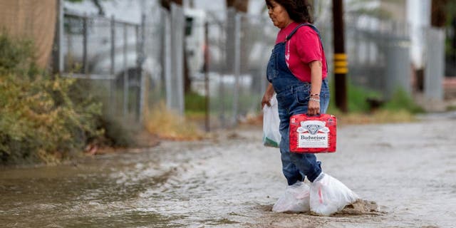 Woman walking in California flood