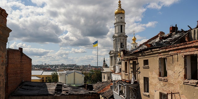 War-tattered town, Ukrainian flag