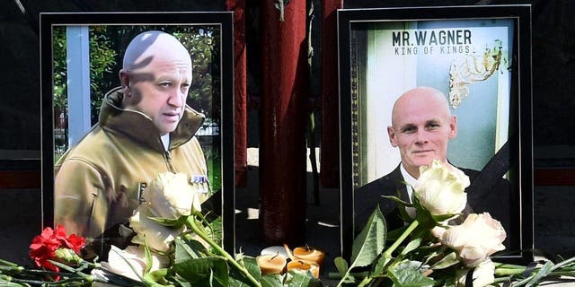 Photographs featuring Yevgeny Prigozhin (L) and Dmitry Utki