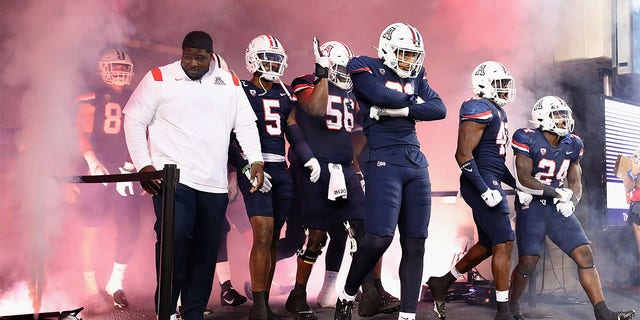 Arizona walks out before a game against Oregon