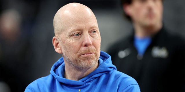 Mick Cronin looks on during practice