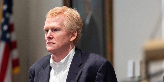 A close-up of Alex Murdaugh in a court house wearing a dark blazer and white collared shirt