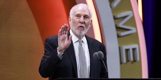 Gregg Popovich talks at podium