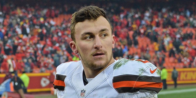 Johnny Manziel looks on field