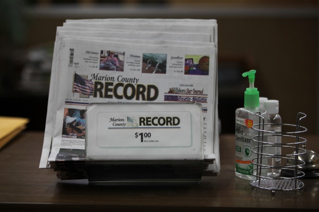 The last printed issue of the Marion County Record sits in a display in its office.