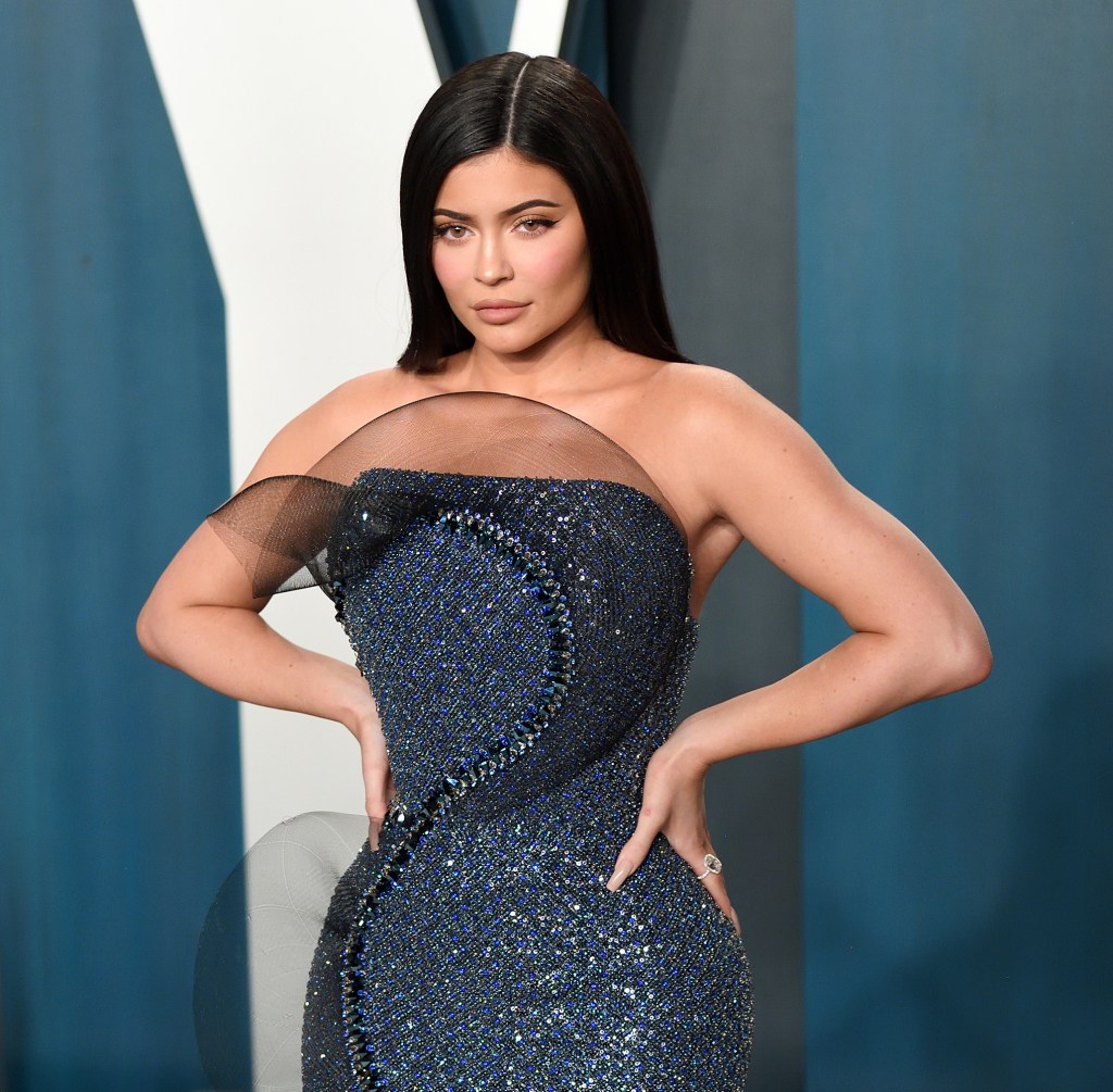 Kylie Jenner in a form fitting rhinestone gown