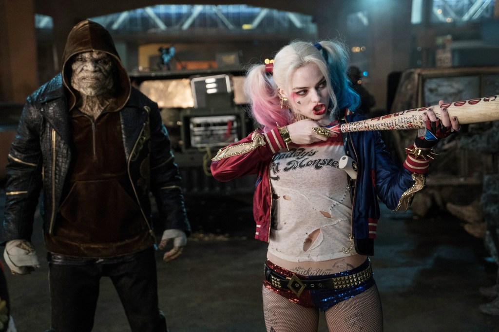 SUICIDE SQUAD, from left: Adewale Akinnuoye-Agbaje, Margot Robbie, 2016. ph: Clay Enos / © Warner Bros. / Courtesy Everett Collection