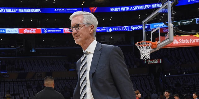 Mike Breen walks on court