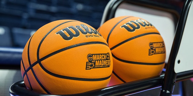 NCAA basketballs on rack