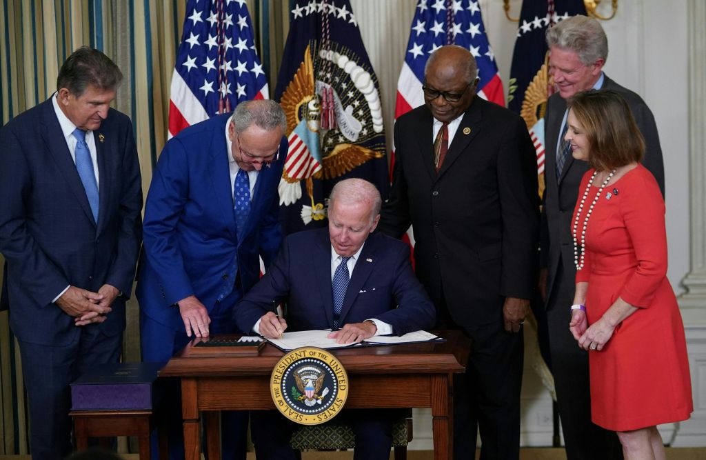  US President Joe Biden signs the Inflation Reduction Act of 2022 into law during a ceremony in the State Dining Room of the White House in Washington, DC.