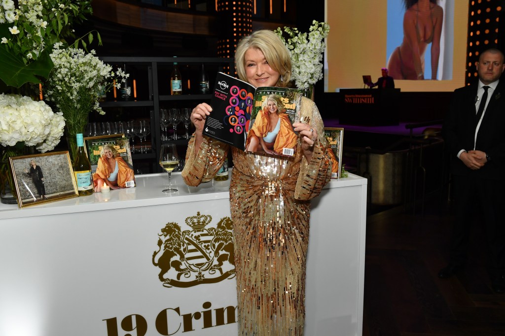 Photo of Martha Stewart in a sequined gown reading a magazine. 