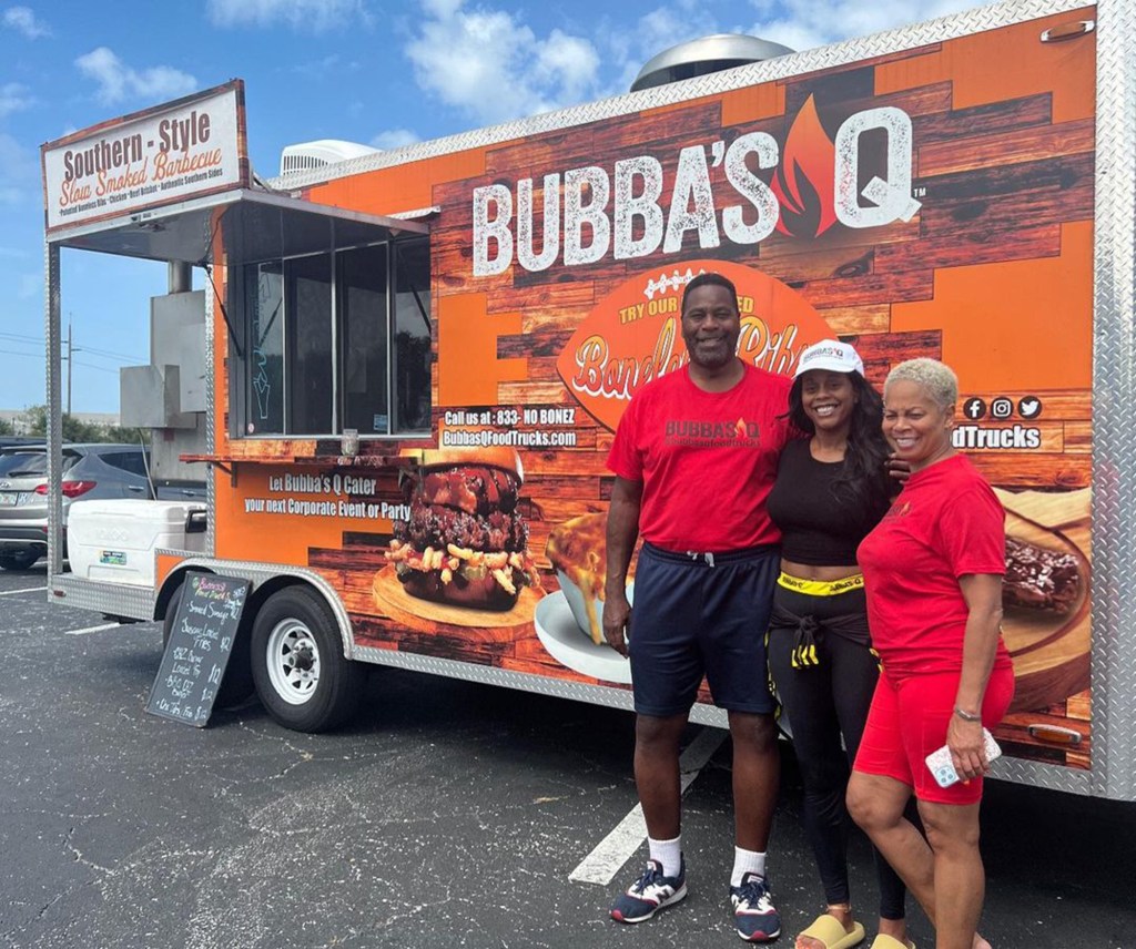 Bubba Baker and family outside his foodtruck.