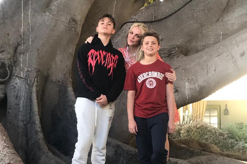 Britney Spears with her two sons posing for a photo
