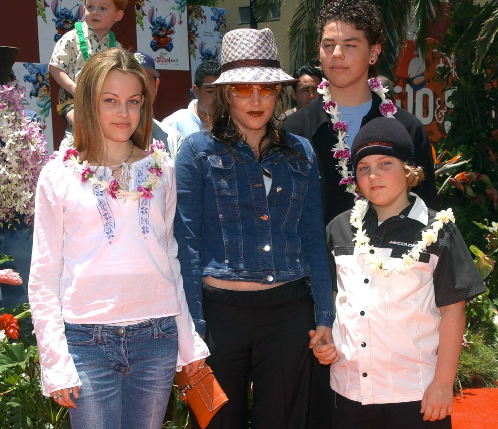 Lisa Marie Presley and her children Benjamin Keough (R),  Riley Keough (L), and her half-brother Navarone Garibaldi (back) 