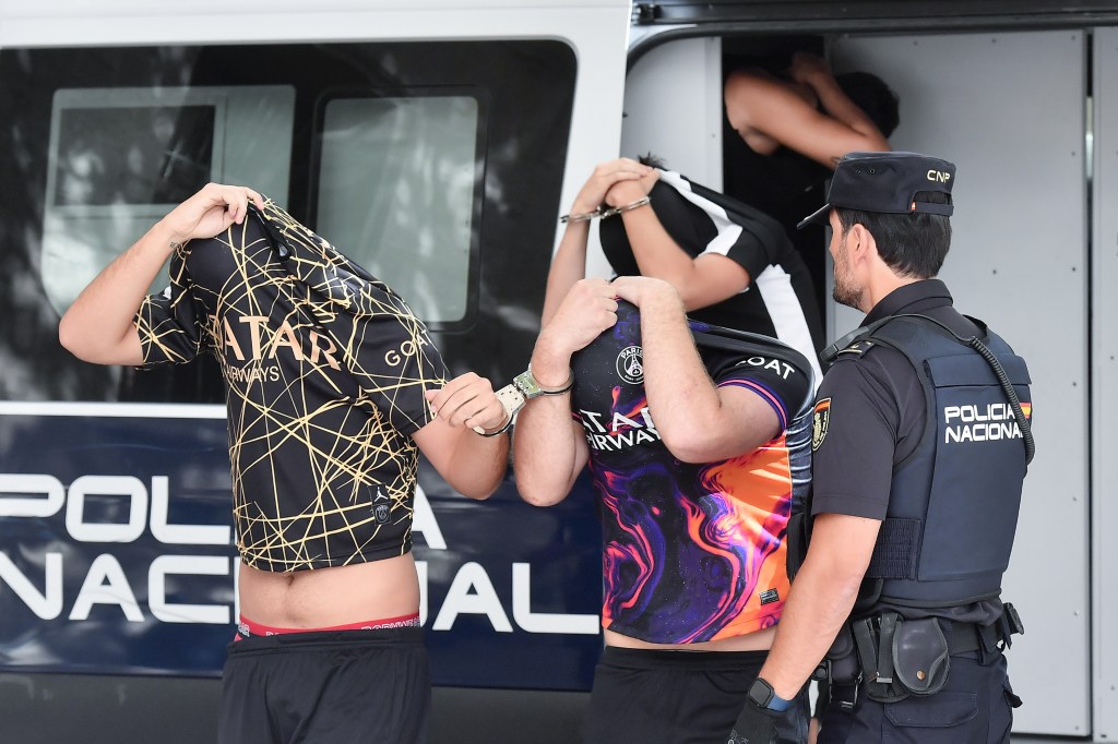 Spanish policemen escort two of the six German tourists arrested for allegedly sexually assaulting a German young woman upon arrival to the courts of Palma de Mallorca, Mallorca Island, Balearics, Spain, 15 July 2023.