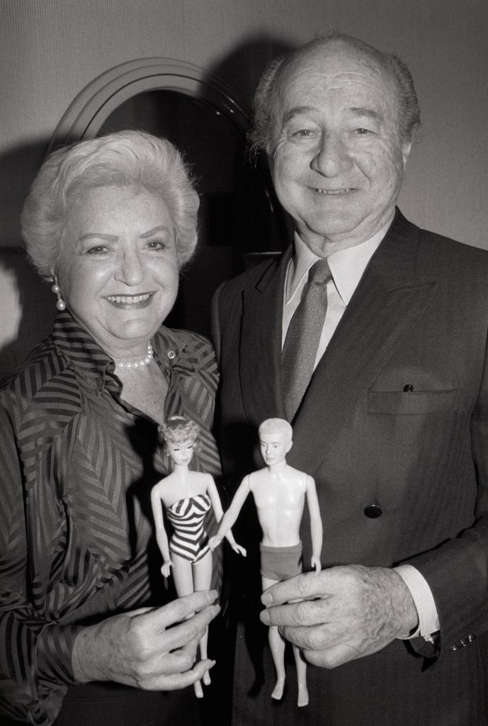 A portrait of Ruth and Elliott Handler, the couple who introduced the Barbie doll in 1959, holding a Barbie and Ken doll. 
