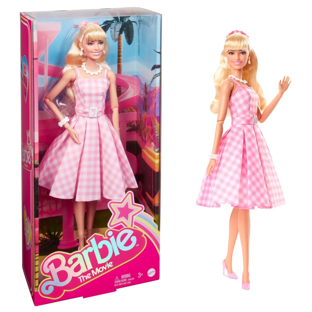 A shot of a Barbie in and out of her Barbie box.