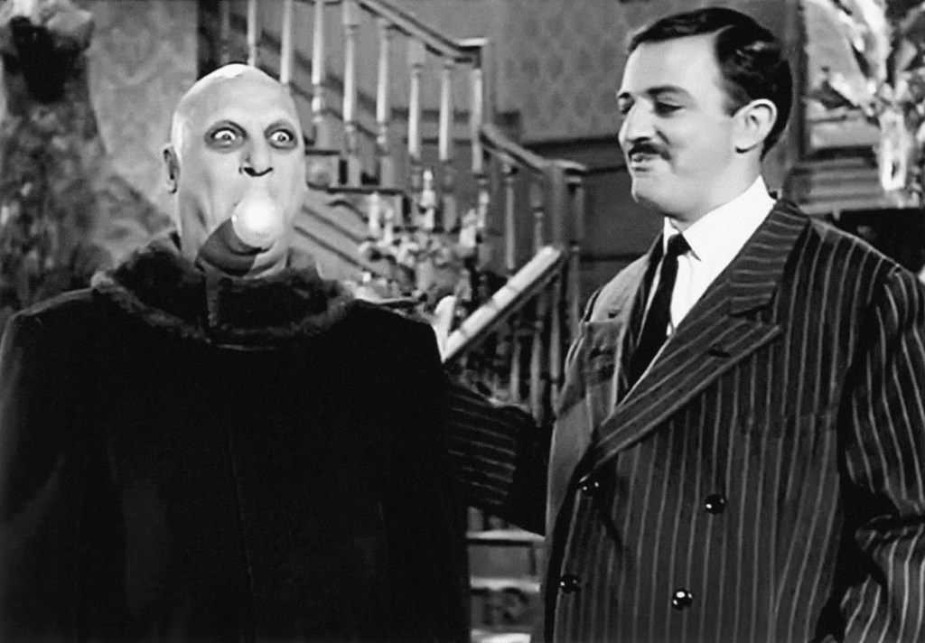 Still-shot of Gomez Addams and Uncle Fester.