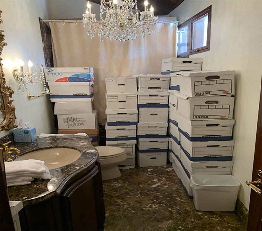 In this handout photo provided by the US Department of Justice, stacks of boxes can be observed in a bathroom and shower in The Mar-a-Lago Club's Lake Room at former US President Donald Trump's Mar-a-Lago estate in Palm Beach, Florida
