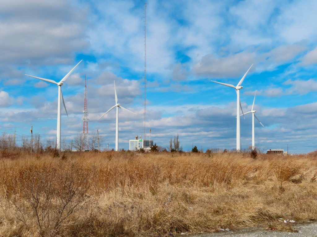 This Feb. 18, 2022 photo shows land-based windmills in Atlantic City N.J. that help power a sewage treatment plant